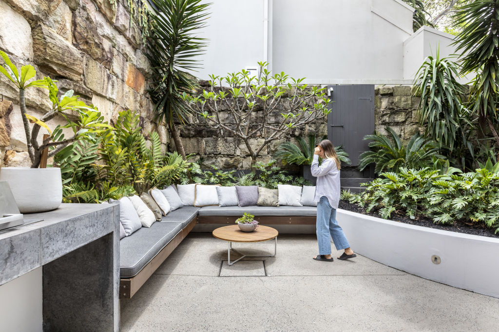 The north-facing courtyard features a curved garden bed and a built-in barbecue. Photo: Supplied