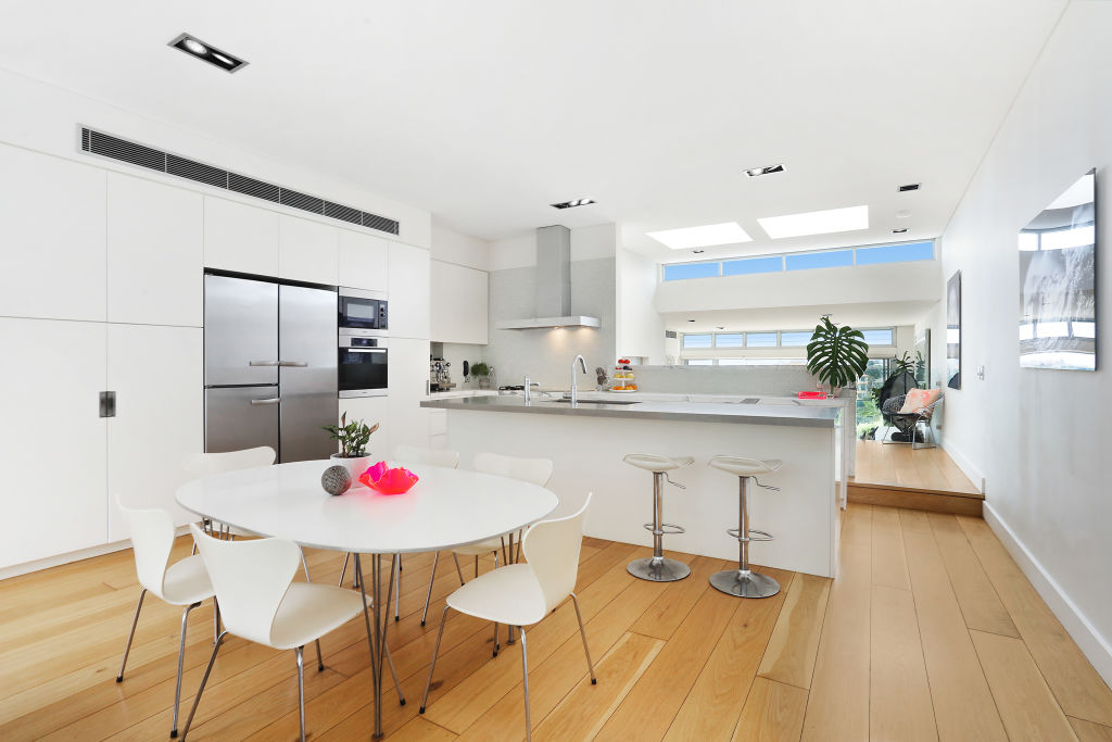 The kitchen includes a marble benchtop, a convection oven and an island breakfast bar. Photo: Supplied