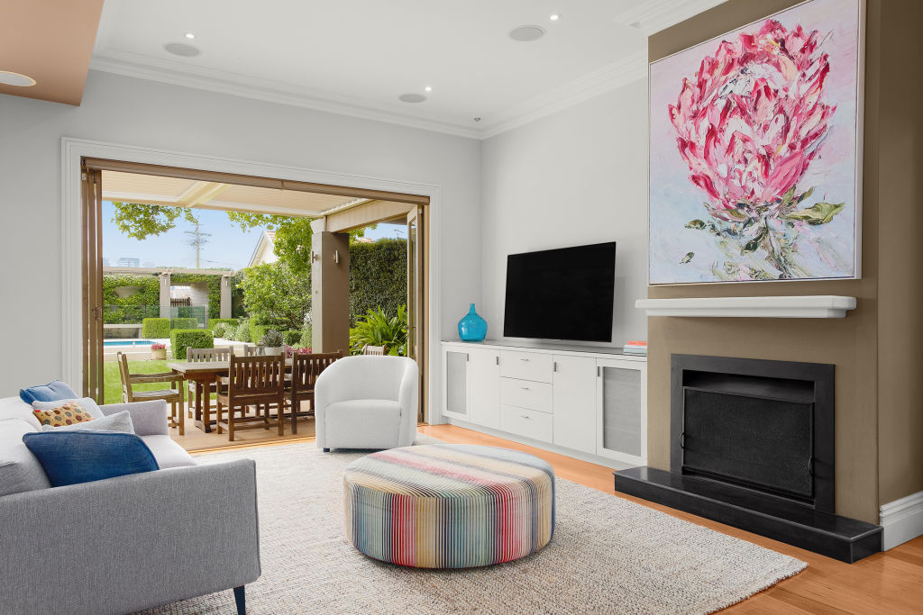 The living room opens out to the gorgeous garden. Photo: Supplied