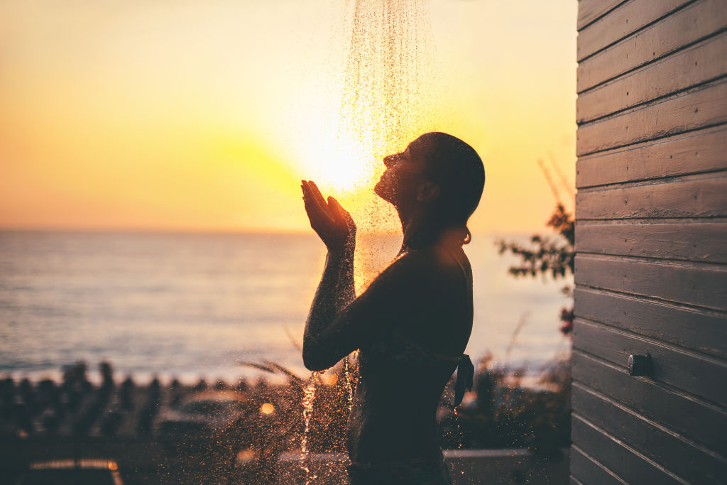 An outdoor shower helps keep the house clean and dry. Photo: Pekic