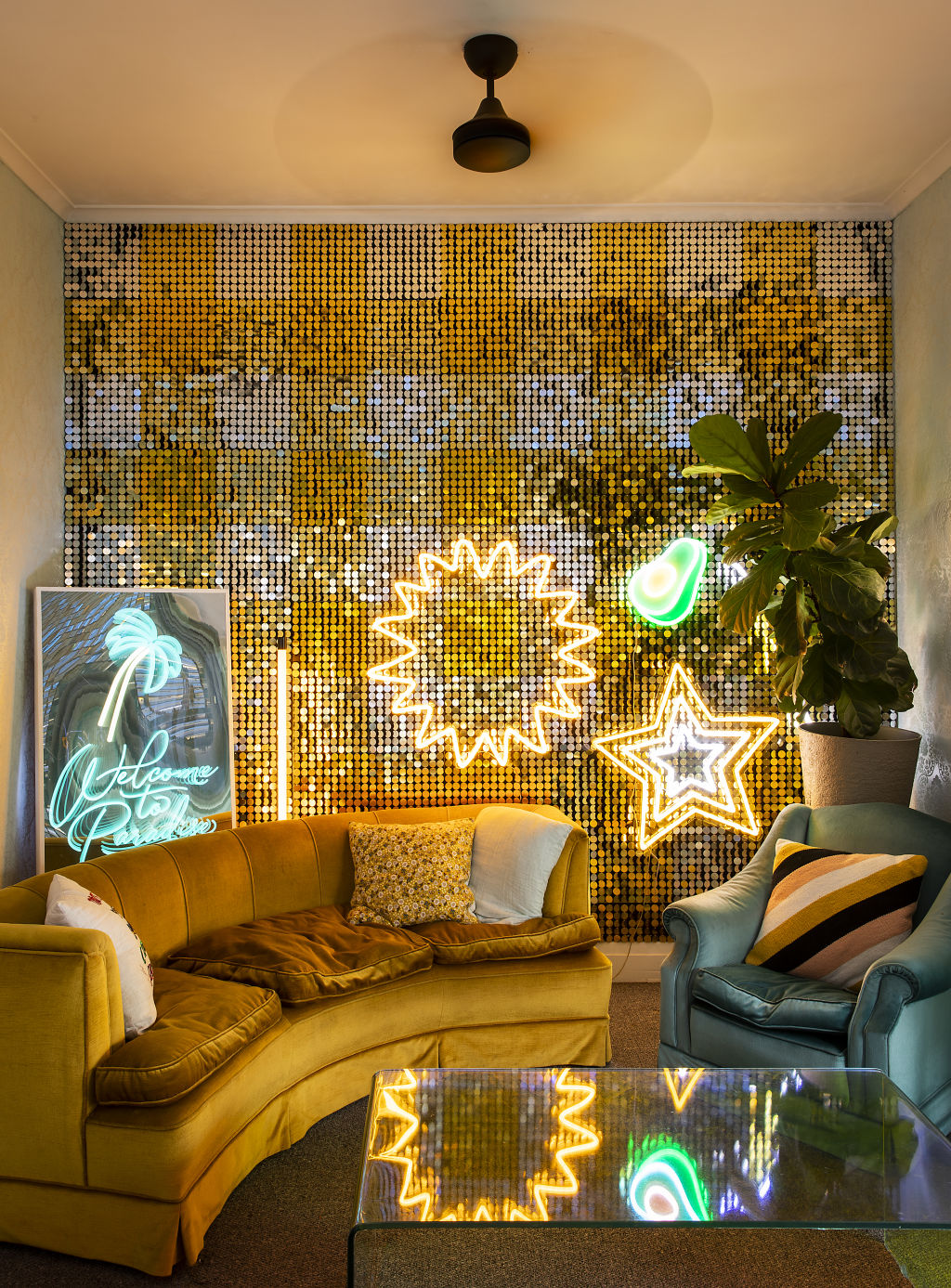 The gold shimmer wall in the living room flutters under a fan-forced breeze. Photo: Charlie Kinross