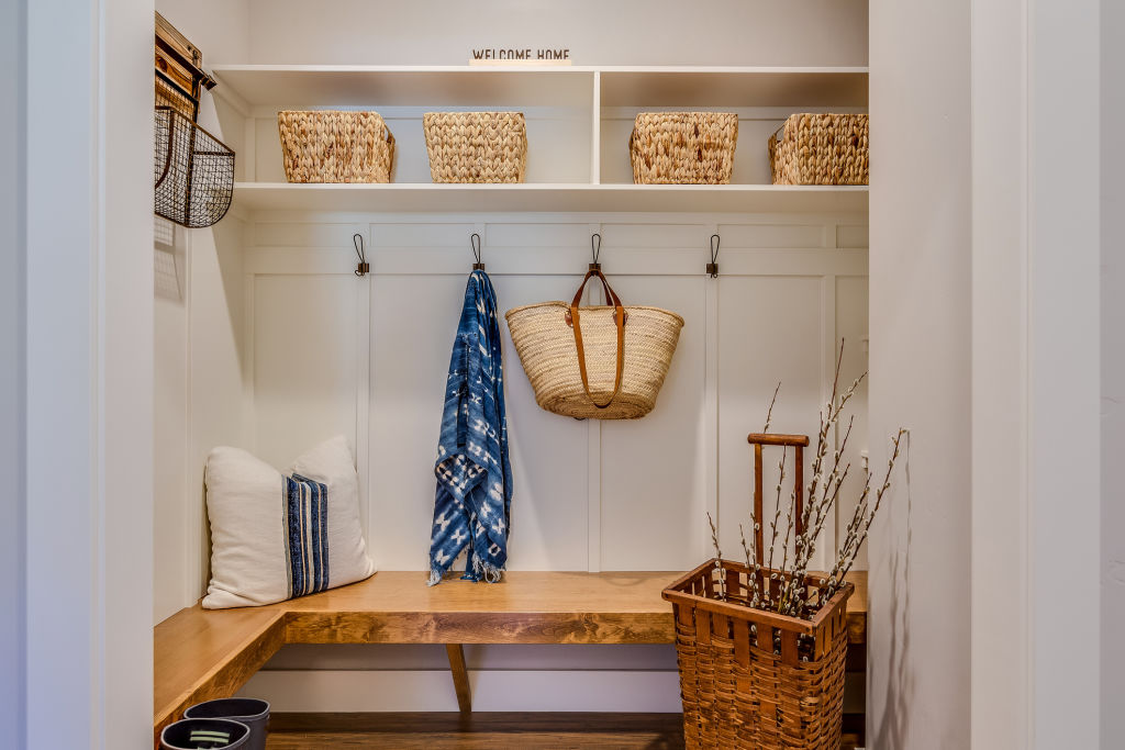 All you need is some sturdy hooks and baskets to turn your entryway into an organised hub. Photo: PC Photography