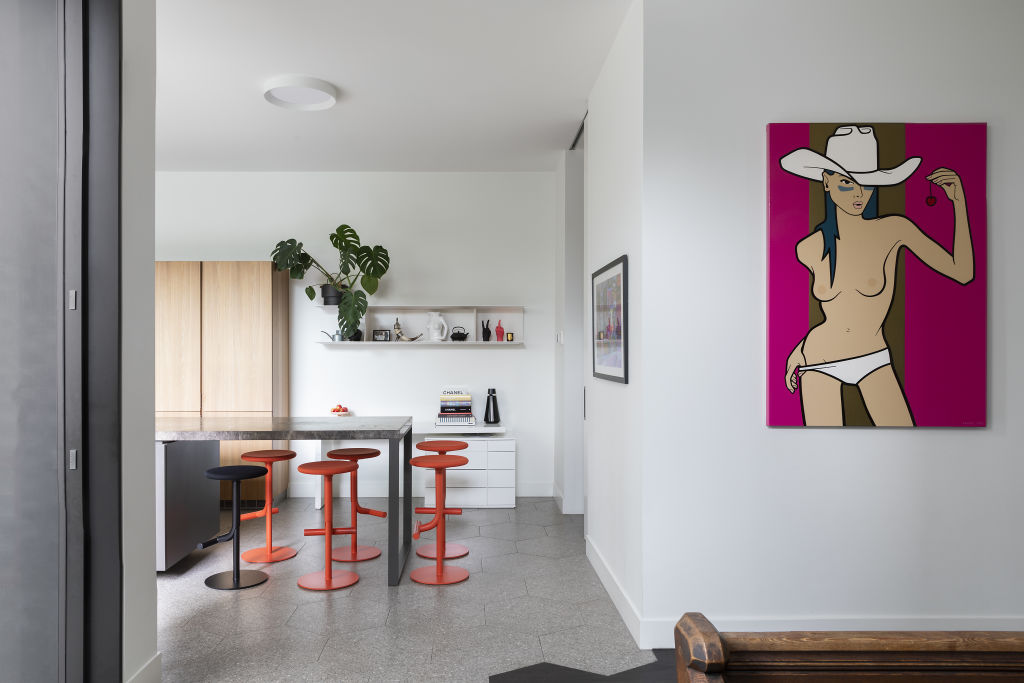 Theres simplicity throughout the home with pops of eclectic artwork and styling. Photo: Charlie Kinross