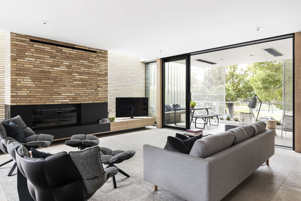 The slim lines and muted bricks bring warmth to the living space.  Photo: Supplied