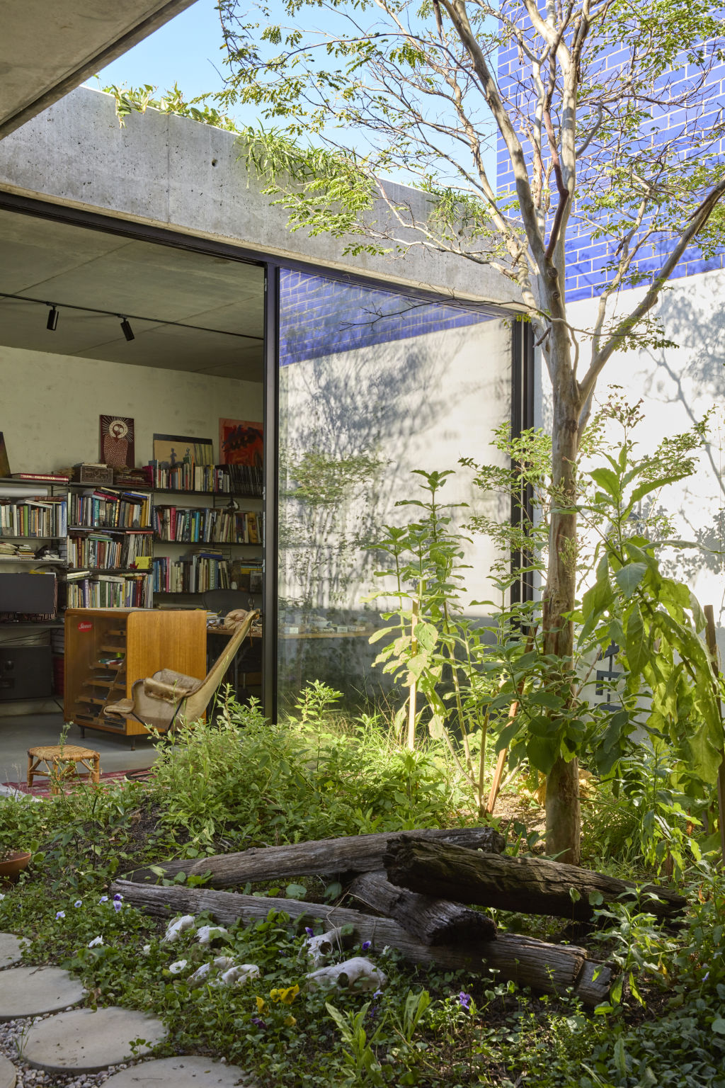 The home's garden surrounding is integrated into its design. Photo: Jack Lovel