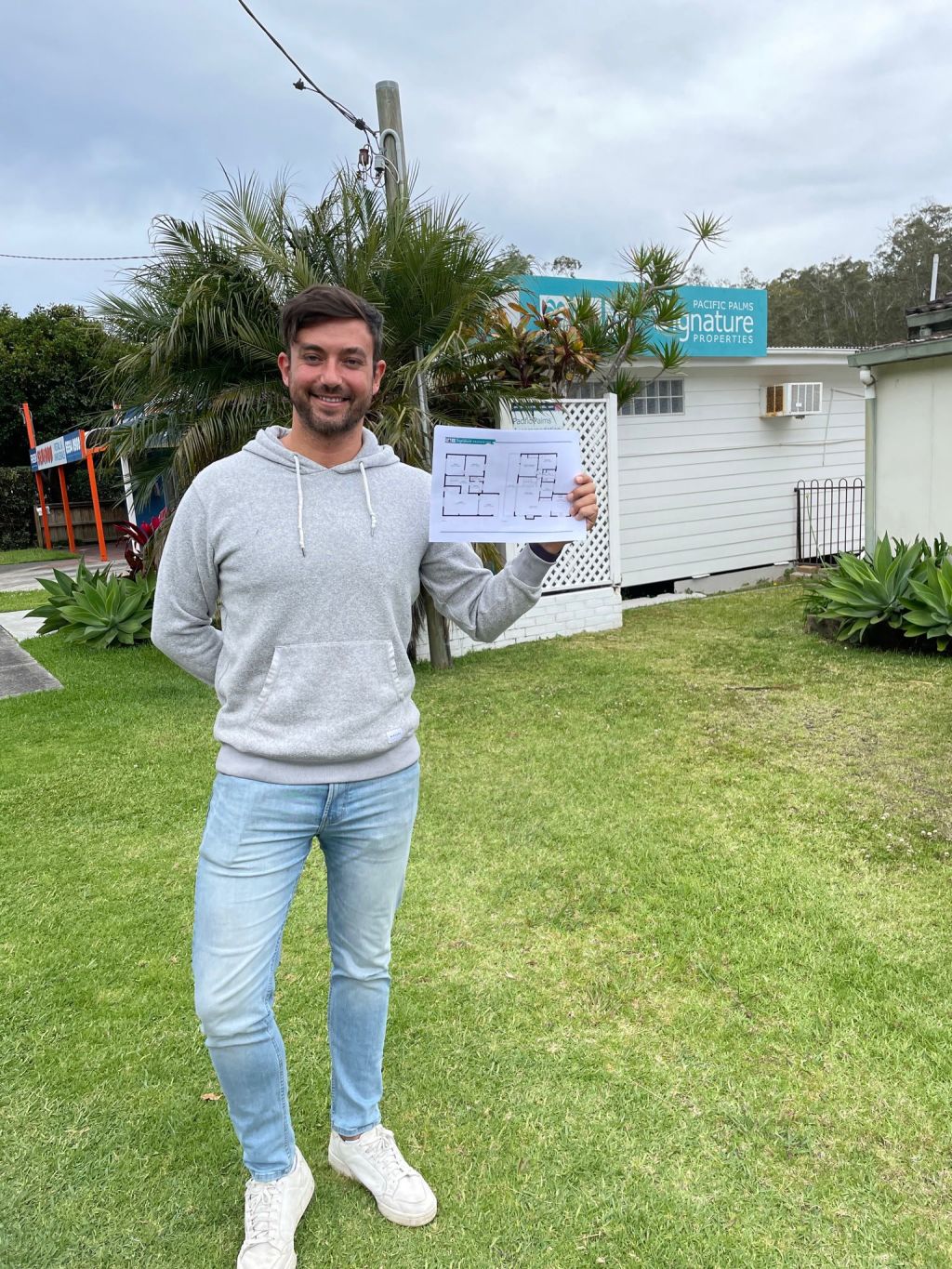 Rafael Canto in Smiths Lake, holding his house plans. Photo: Supplied
