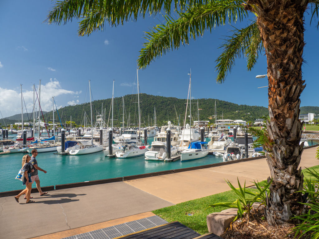 Airlie Beach is prized by affluent families who love life along the water. Photo: Mark Fitz