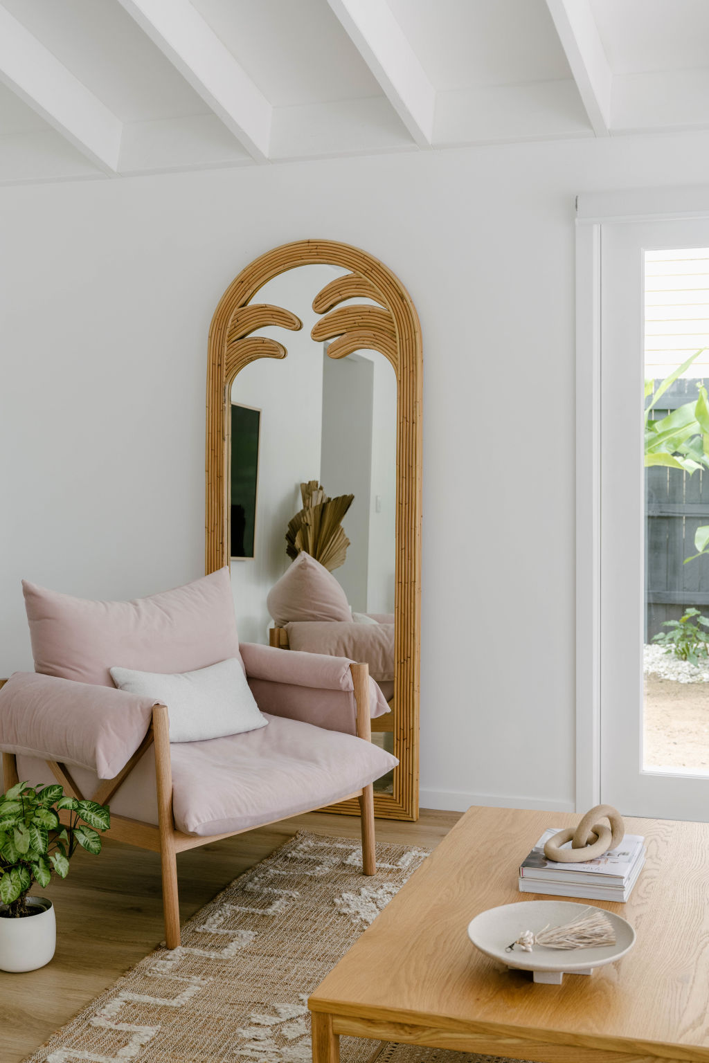 The high, raked ceilings look beautiful above the now open-plan kitchen, dining and living zone. Photo: Hannah Puechmarin