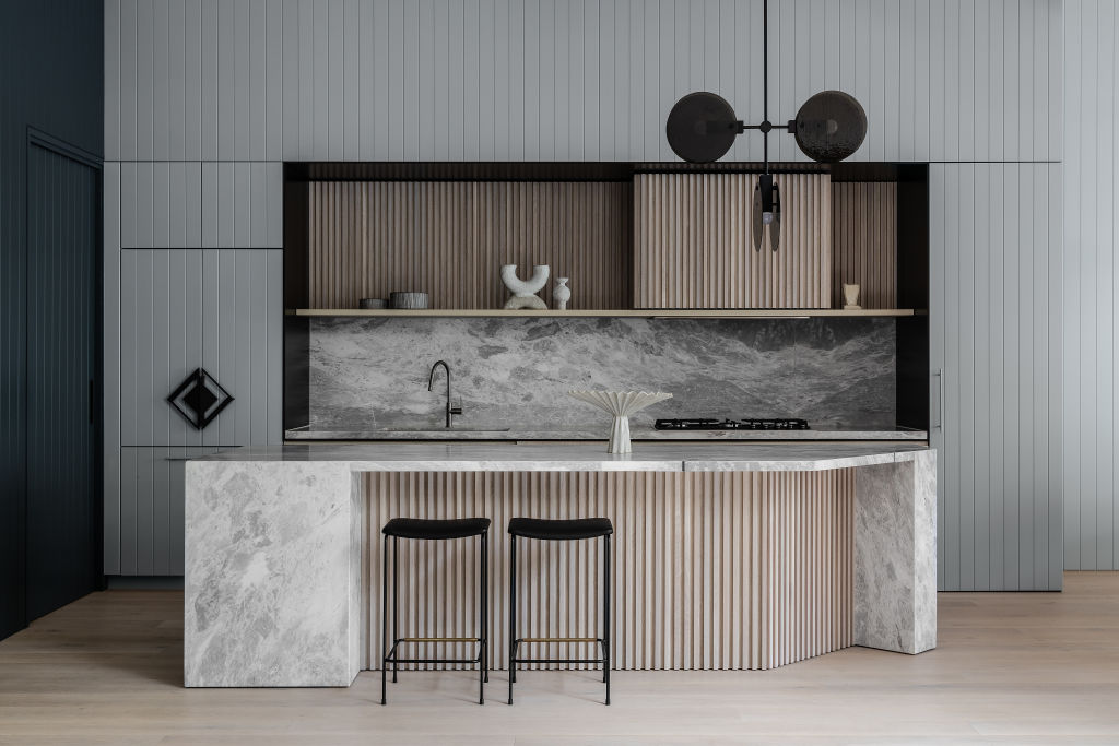 The combination of blacks, greys and neutrals has been blended perfectly in the kitchen. Photo: Timothy Kaye