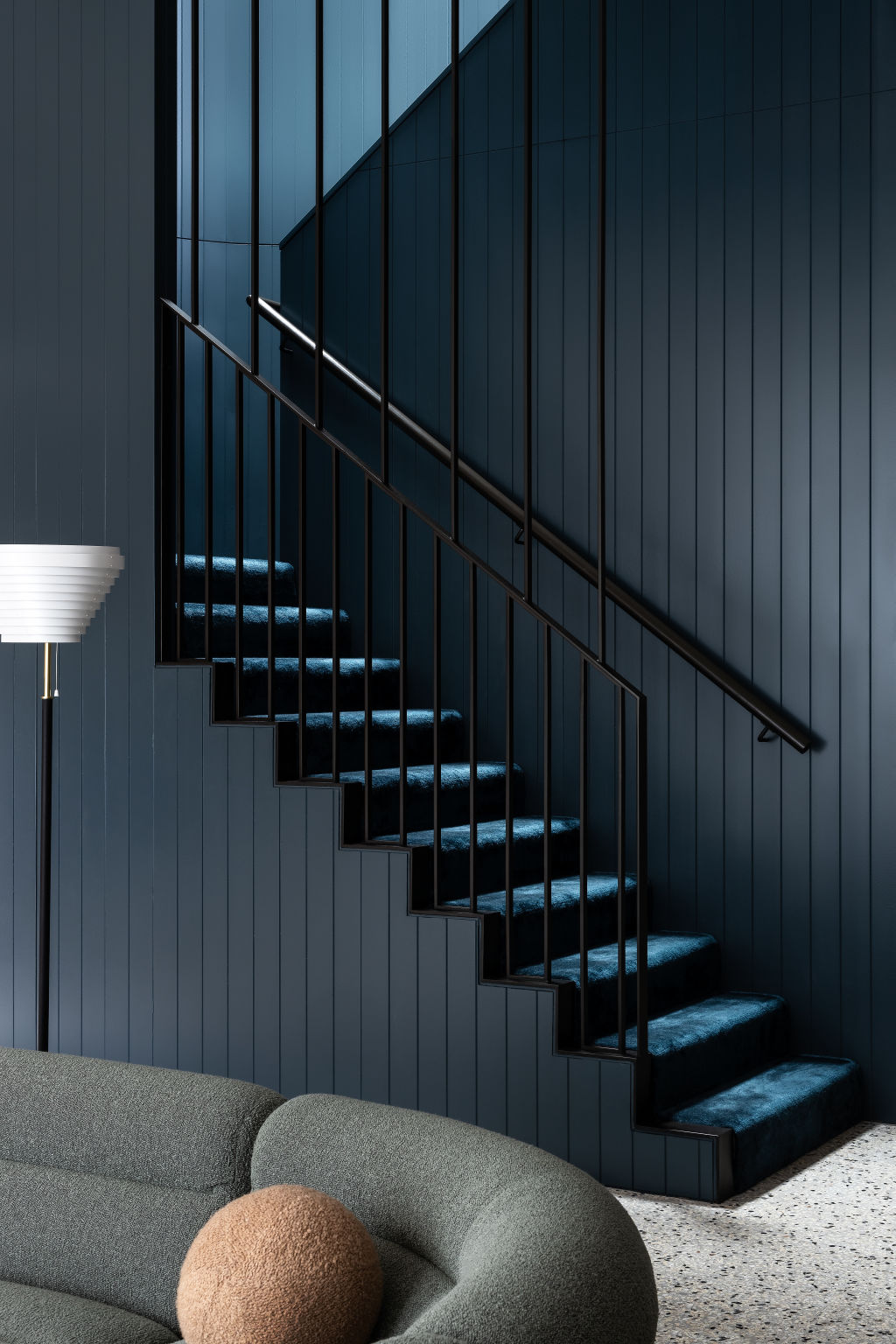 Rich tones and textures on the staircase making it a focal point. Photo: Timothy Kaye