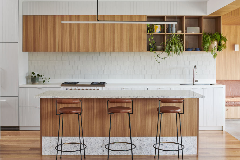 Profile 2pac joinery and 30-millimetre Bianco Neve terrazzo on the island benchtop and kicker add texture and interest. Photo: Dean Bradley