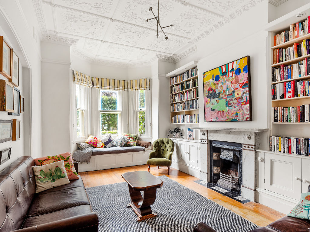 The front living room features a fireplace and a north-east facing bay window. Photo: Supplied