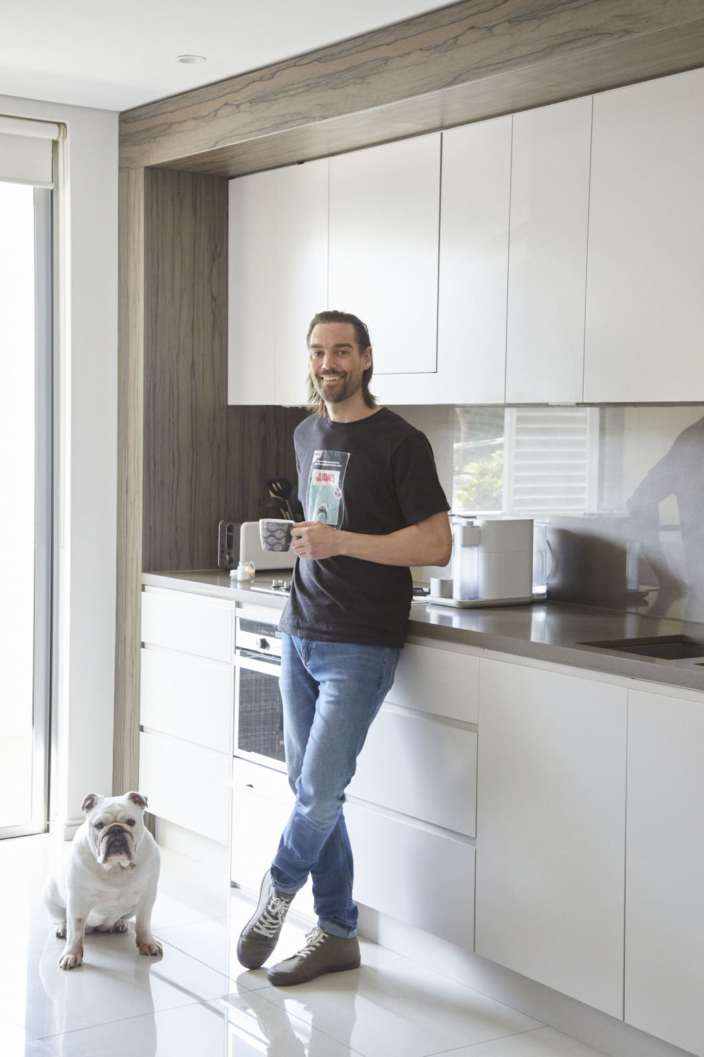 Crosher shares an apartment with his bulldog, Nala. Photo: Nicky Ryan