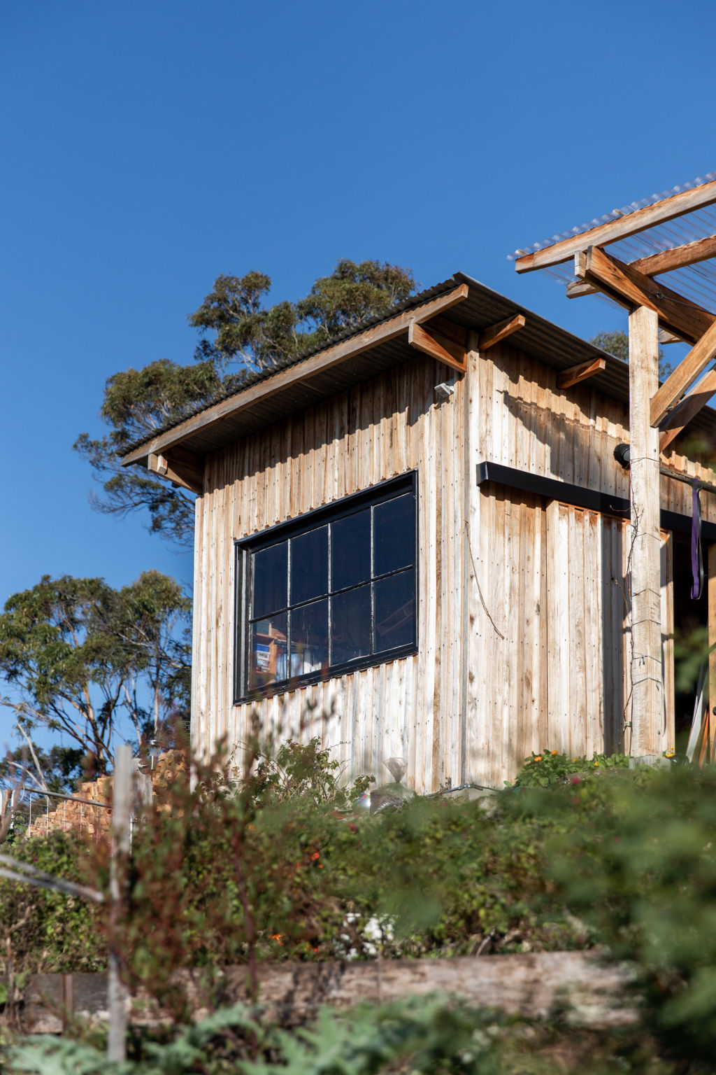 In 2020, the couple finished building a separate garden office made from local hardwood timber. Photo: NATASHA MULHALL