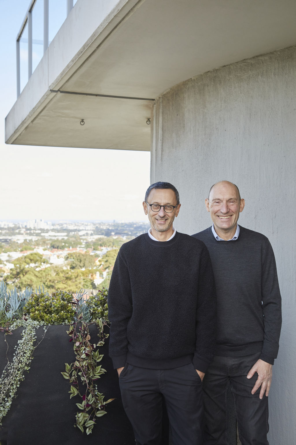Russell Rodrigo and Michael Beckett get 270-degree views of the city skyline from the five balconies. Photo: Nicky Ryan