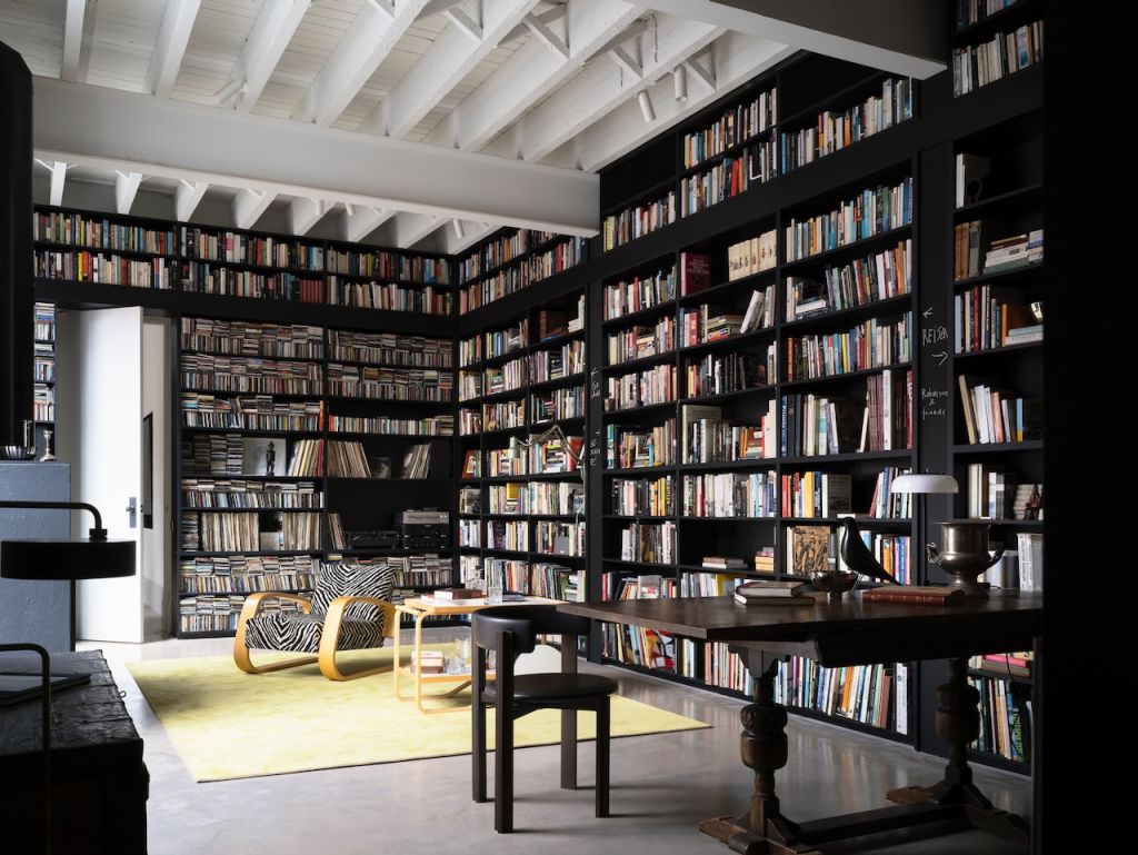 The owner's collection of 30,000 books is housed in a library off the living space. Photo: Justin Alexander