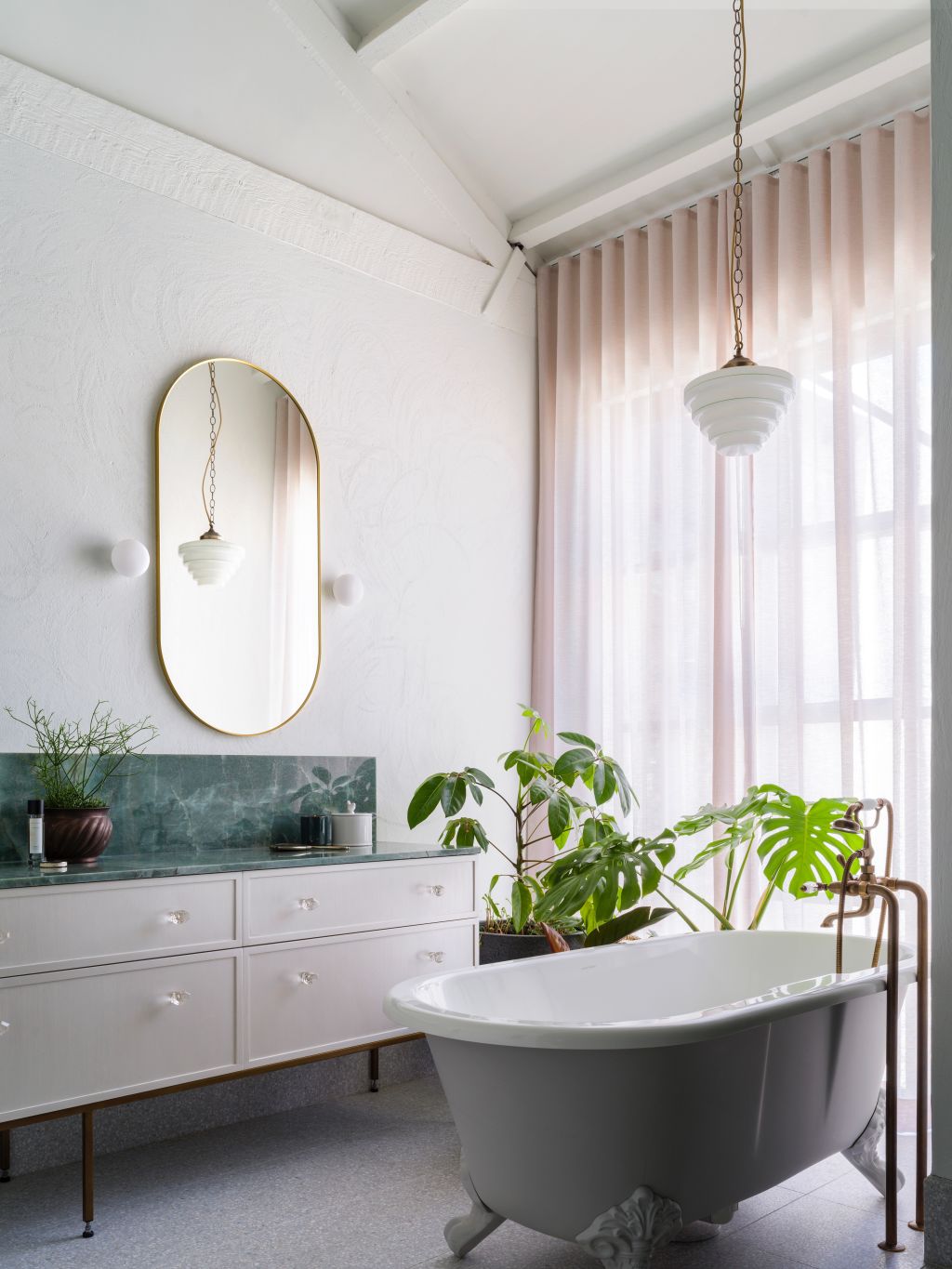 ... and bathrooms decorated in pink, green and black. Photo: Justin Alexander