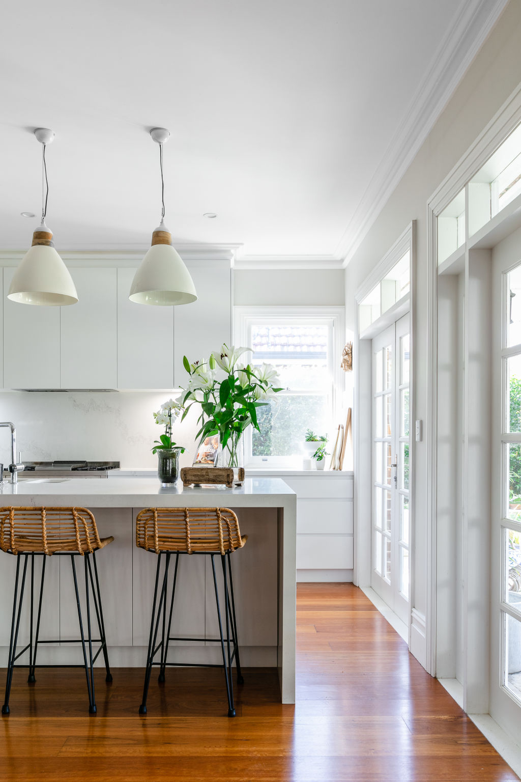 The restoration included this modern kitchen with a walk-in pantry. Photo: Moss + Co Photography