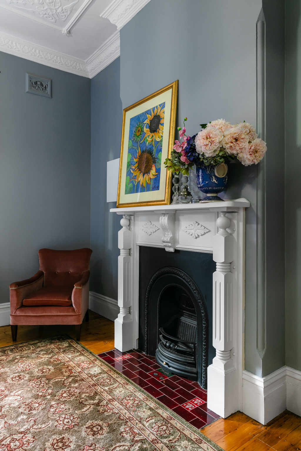 The living room features an original fireplace that the couple restored. Photo: Moss + Co Photography