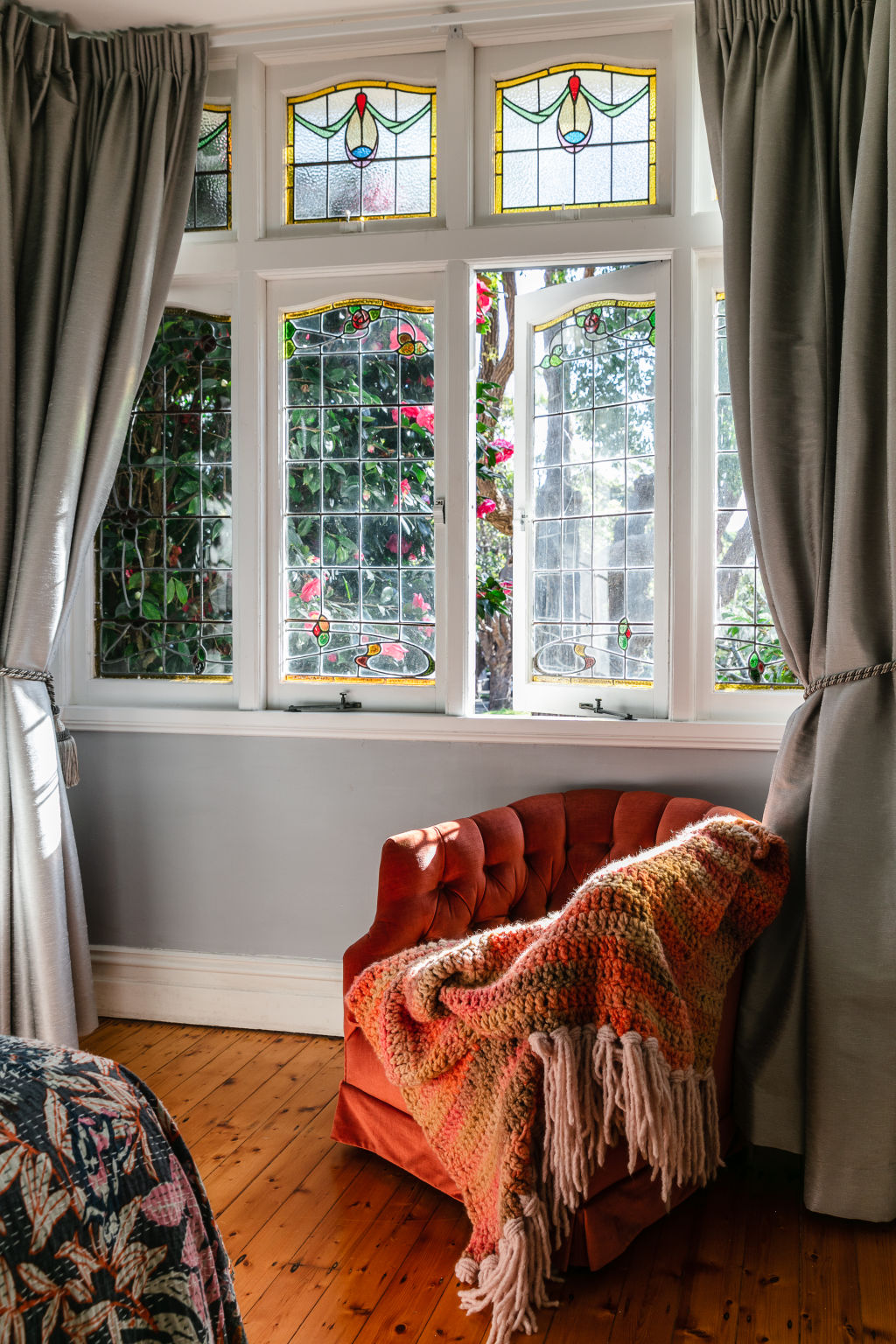 The couple preserved the integrity of the Victorian home and kept the stained glass windows in the front. Photo: Moss + Co Photography