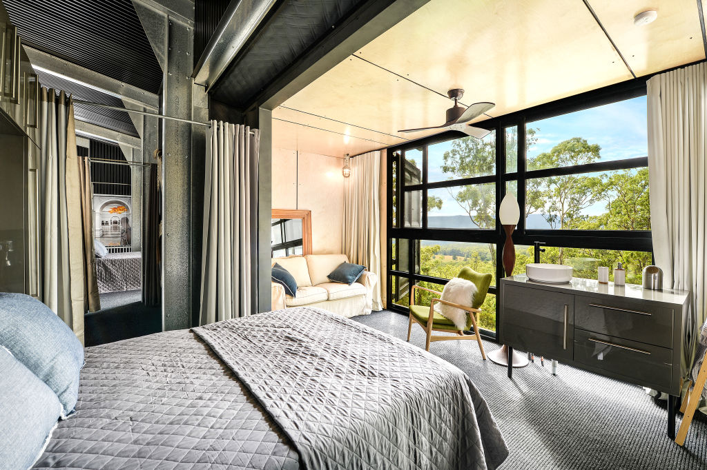 The mezzanine bedrooms capture views of the lush bushland. Photo: Supplied