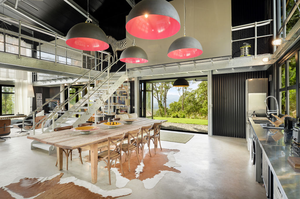 Industrial-style finishes include polished concrete flooring and exposed metals. Photo: Supplied