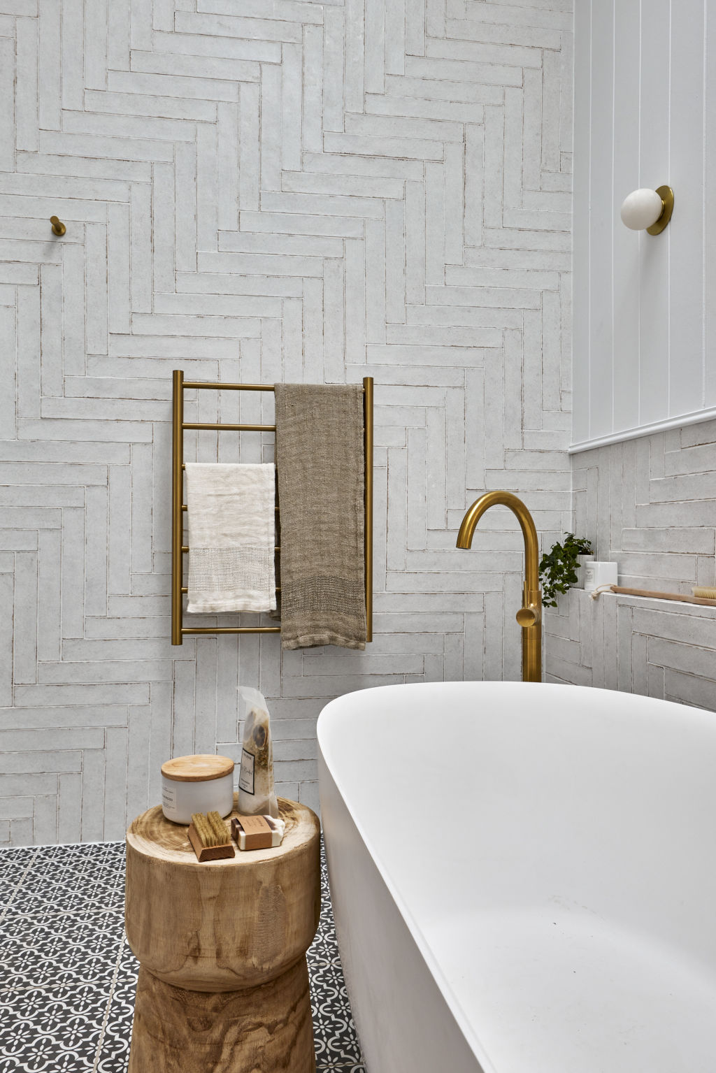 Combining wall tiles and heavily patterned floor tiles is a great way to mix and match without overwhelming the space. Photo: Supplied