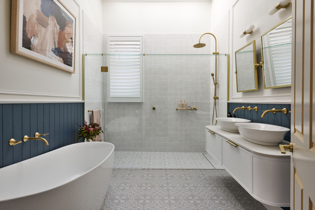 Tom and Sarah-Jane used block colour towels that contrasted with their white and blue bathroom.  Photo: Nine