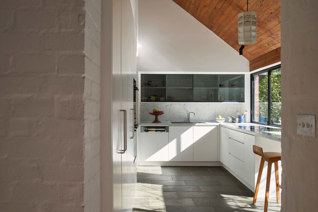 The vaulted ceilings add drama to spaces like the kitchen.  Photo: Supplied
