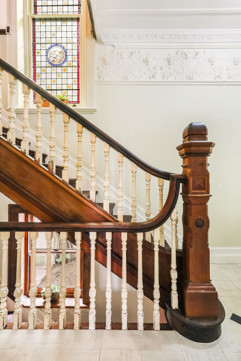 The home is filled with period features including verandahs and a cedar staircase.