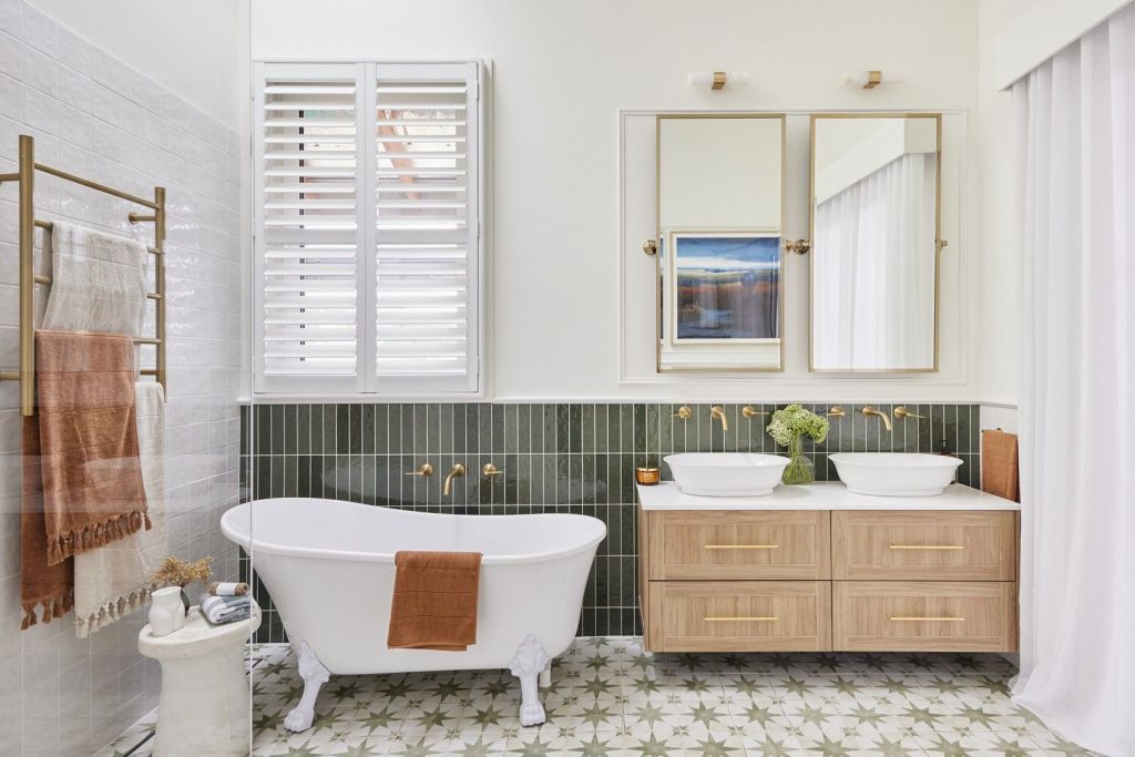 Timeless French doors with surrounding architraves, decorative skirting, and classic window frames give even the simplest en suite architectural flair.  Photo: Belle Property