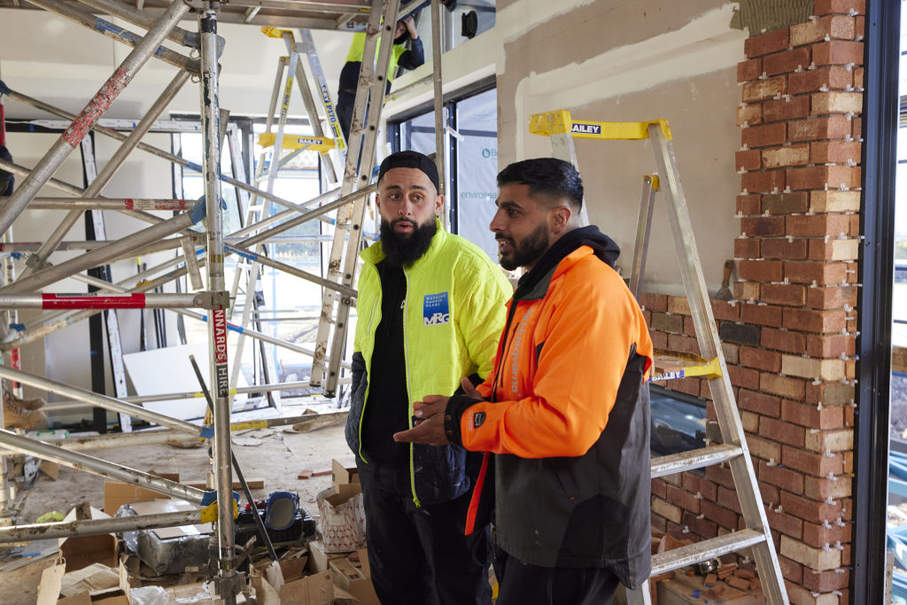 Omar and Oz are having a difficult chat with their builder Danny after Scott Cam raised concerns about their budget. Photo: Nine