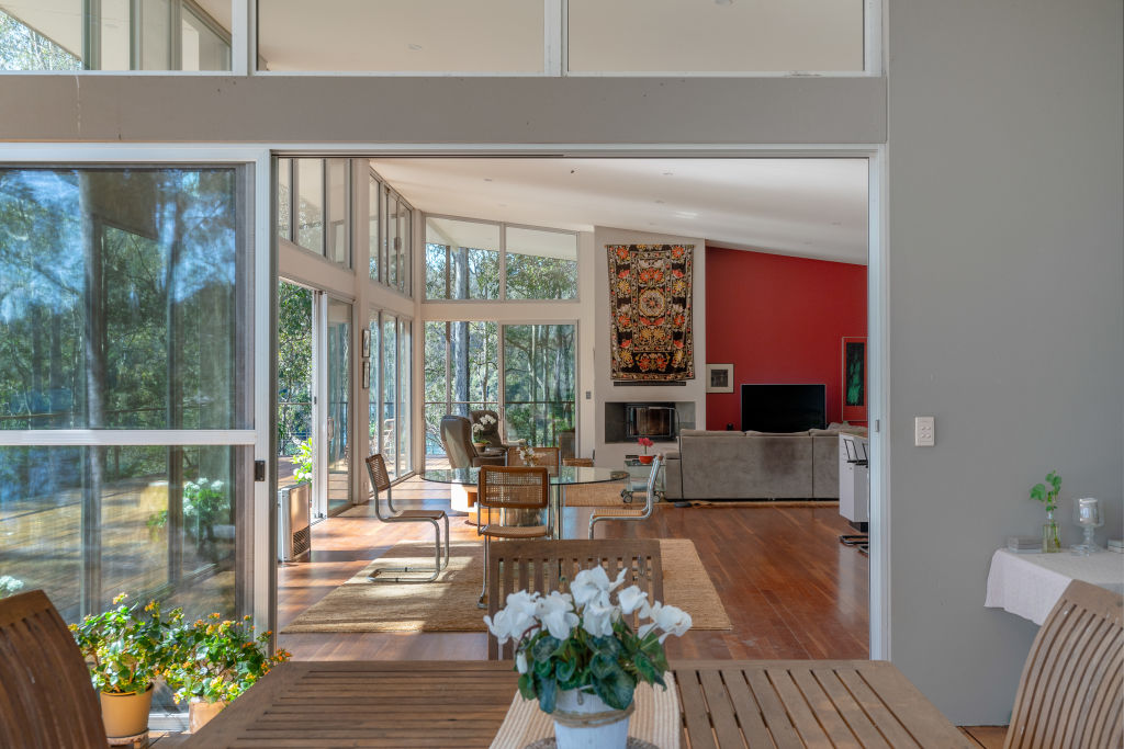 The home enjoys picturesque views of the river and surrounding bushland from its living and dining spaces. Photo: Supplied