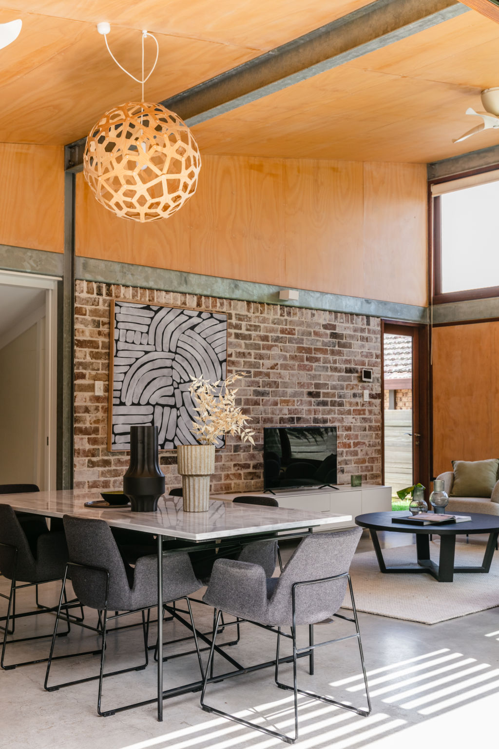 The open-plan living area was sustainably designed and made. Photo: Moss & co