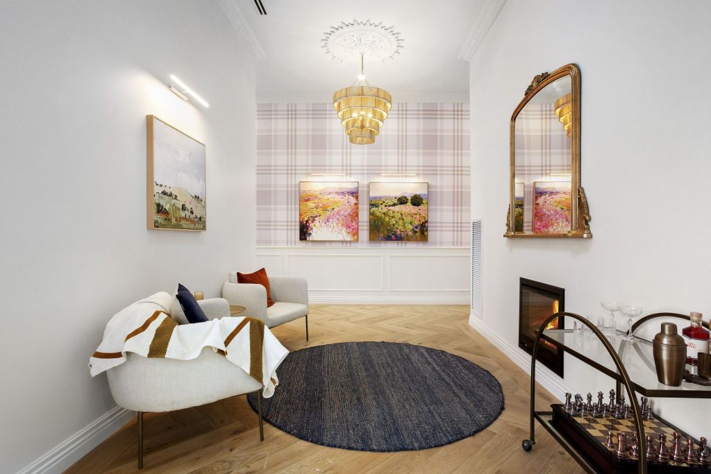 Smart tartan wallpaper is contrasted with beautiful subtle prints on House 1. Photo: Belle Property Daylesford