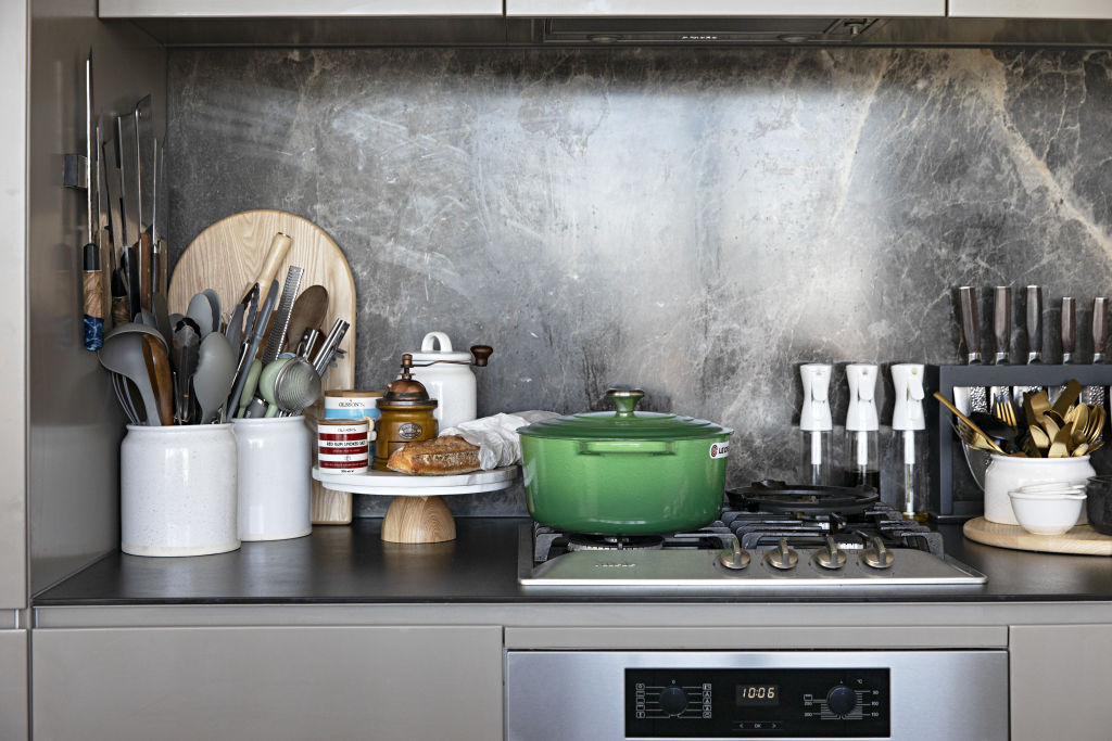 Just as you’d expect, the sleek kitchen  is the heart of Ong’s home. Photo: Natalie Jeffcott
