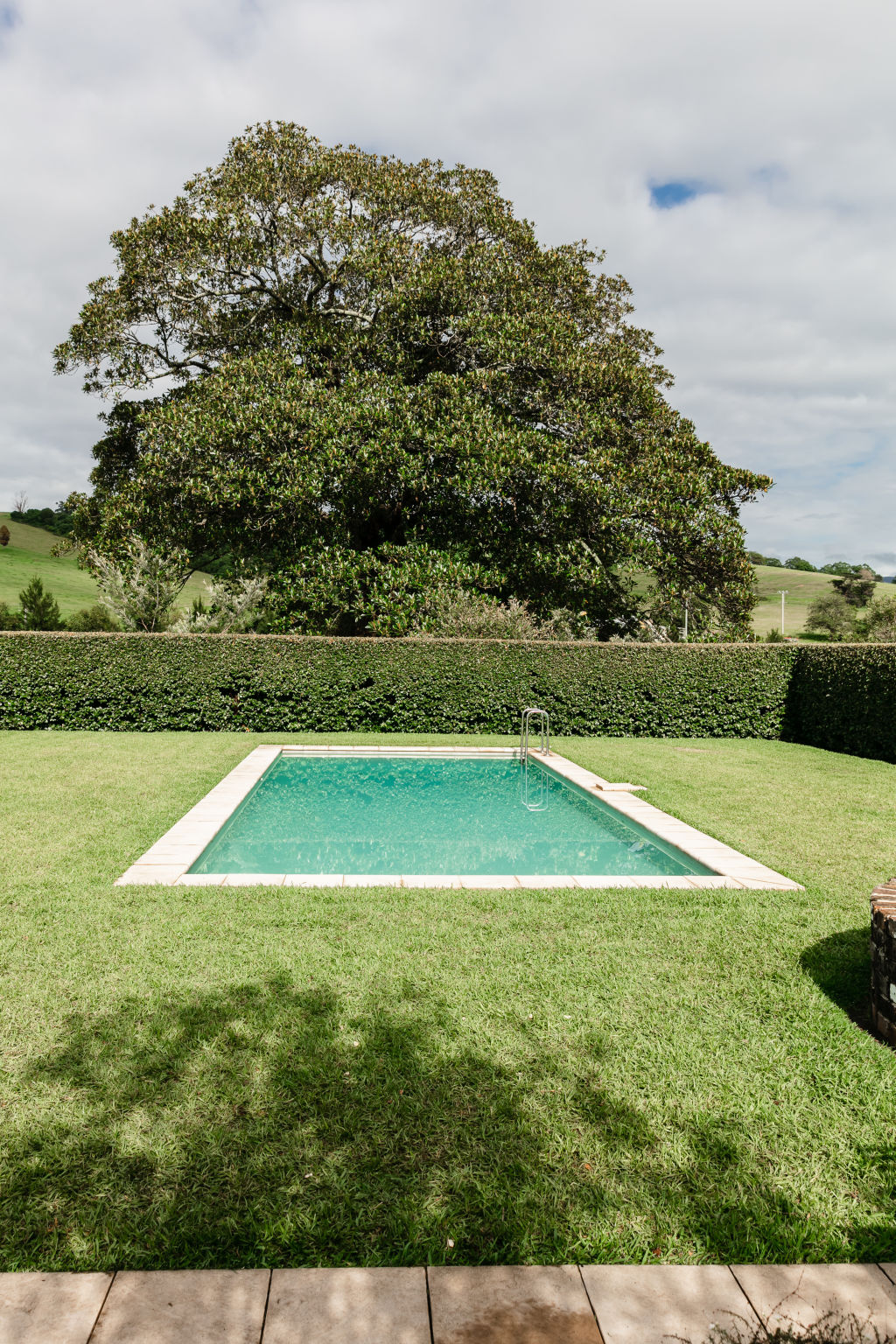 The pool is surrounded by trees planted as far back as 1870. Photo: Moss &amp; Co - Trudy Pagden