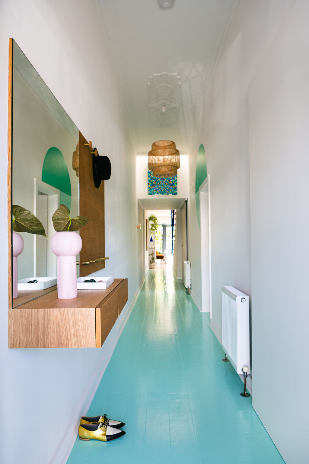 Those minty-green floorboards are the first show-stopping feature in a house full of them. Photo: Greg Briggs