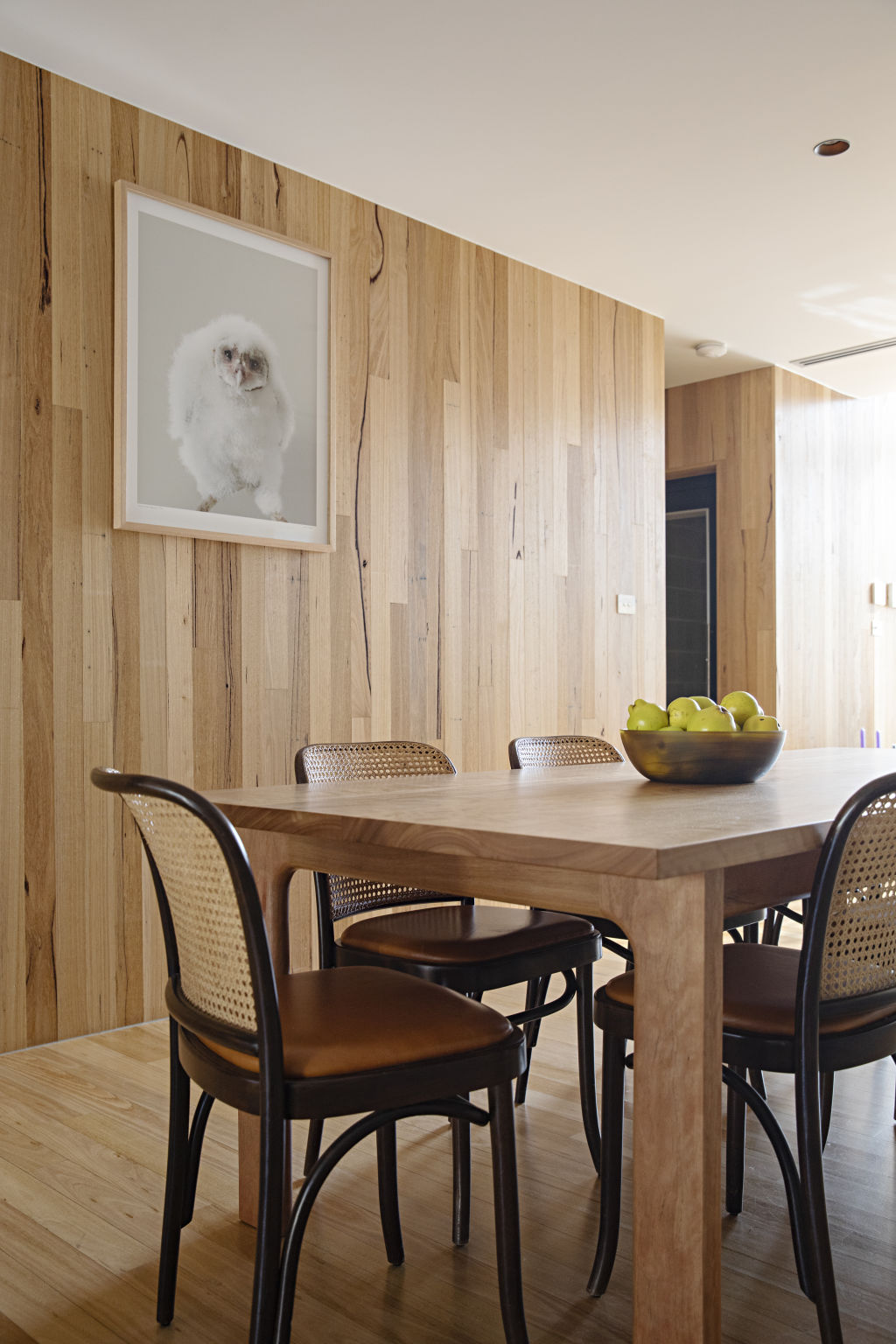 A print by artist Leila Jeffreys sits above the custom-made dining table. Photo: Natalie Jeffcott