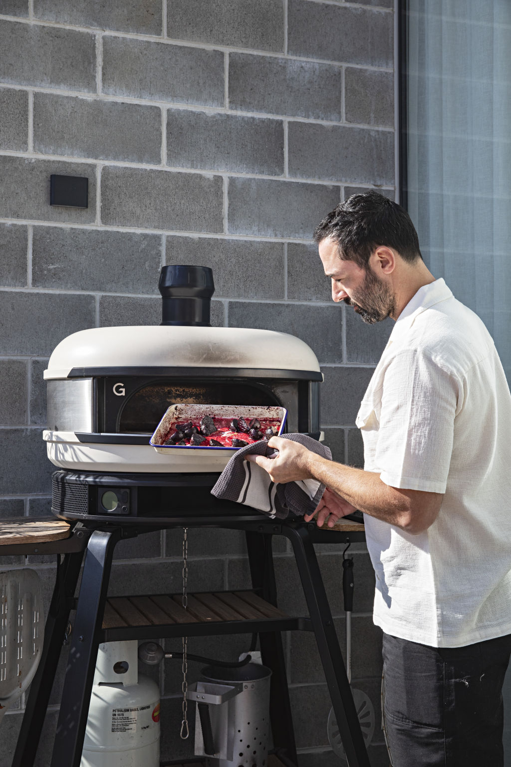 'I know it looks small, but I cook in this thing all the time,' Allen says of the pizza oven, used to whip up midweek meals. Photo: Natalie Jeffcott