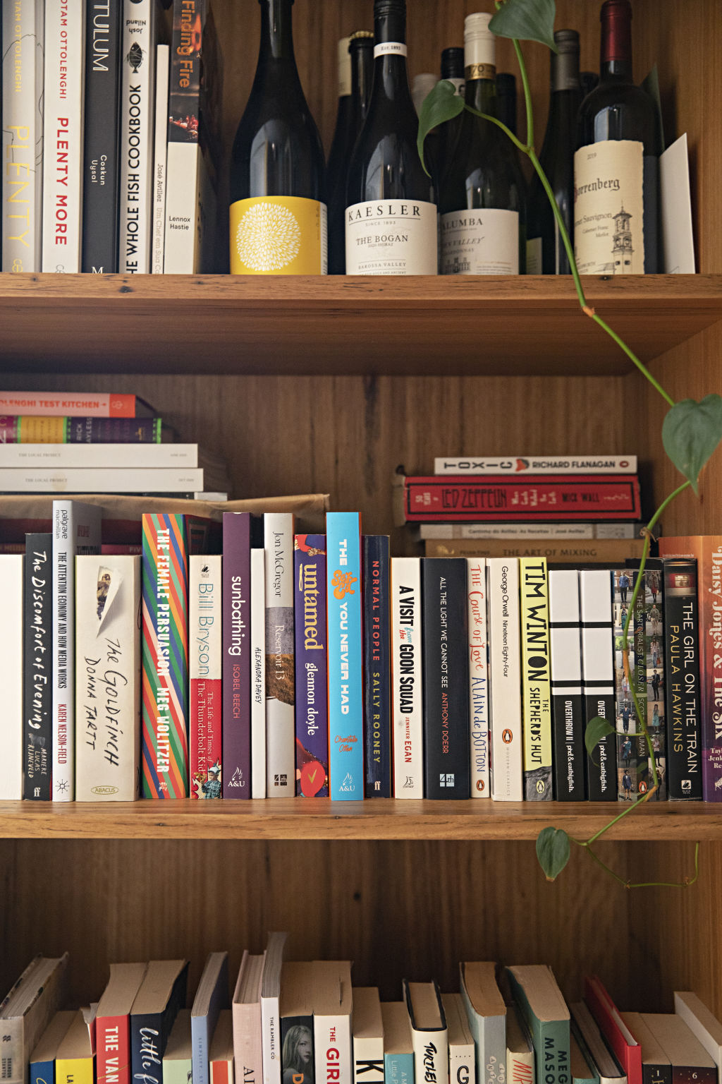The home is accented with many purchases from abroad, including vases, wine and plenty of books. Photo: Natalie Jeffcott
