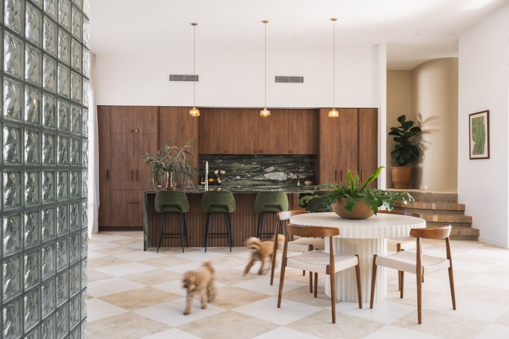 A European holiday inspired the kitchen, with its marble benchtops and stunning checkered floor tiles. Photo: HANNAH_PUECHMARIN