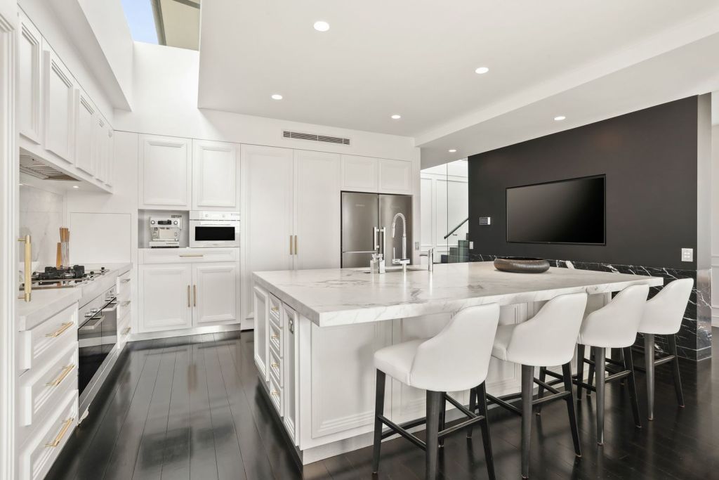 The slab of Italian marble for the kitchen bench was 'craned in over the balcony, because they couldn’t get it up any other way,' Jacenko says. Photo: Highland Double Bay