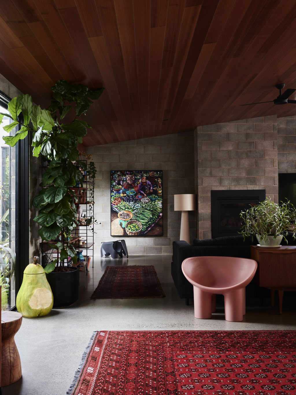 Mark Tuckey&nbsp;timber stool. Sideboard from&nbsp;Grandfather’s Axe. Artwork by&nbsp;Gavin Brown. Eames elephant. Shelves from&nbsp;Smith Street Bazaar. Big Shadow lamp by Marcel Wanders. Vitra Panton chairs. Tobi’s 10-year-old fiddle leaf fig.  Styling: Annie Portelli and Sarah Hendriks. Photo: Eve Wilson