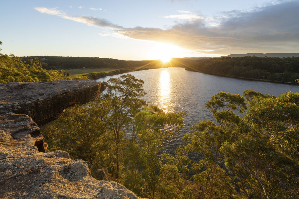Sun setting over Hanging Rock Lookout and the Shoalhaven River, Nowra. Photo: Destination NSW