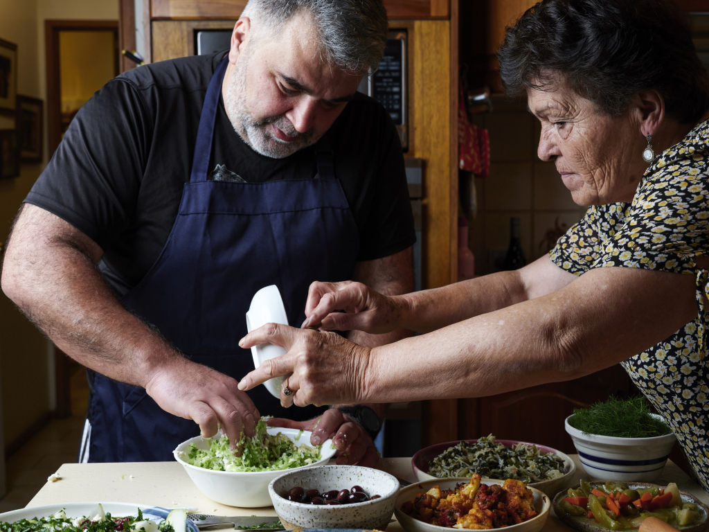 ASRC founder Kon Karapanagiotidis and his mum, Sia, share a love of food. Photo: Peter Tarasiuk