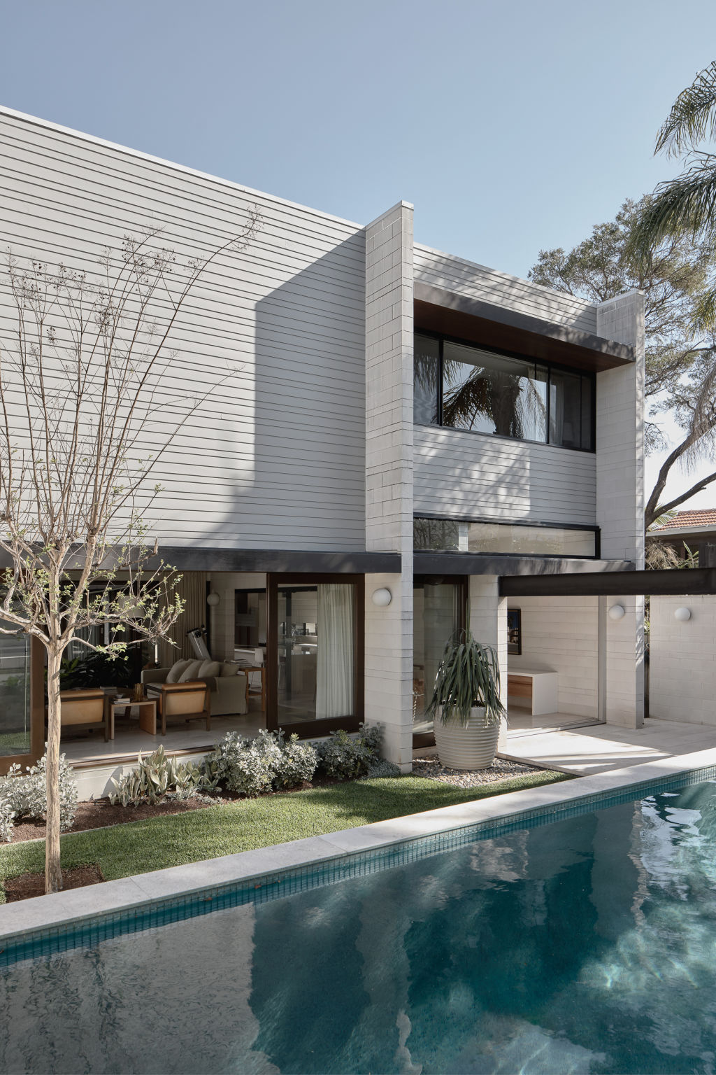 The home is wrapped around the courtyard and the pool, offering complete privacy. Photo: Supplied