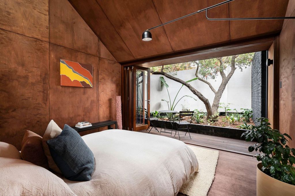 The separate studio with dark timber interior and a private courtyard. Photo: ZSA ZSA Property