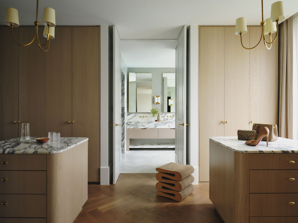 The walk-in wardrobe has the feel of a high-end fashion boutique. Photo: Dave Wheeler