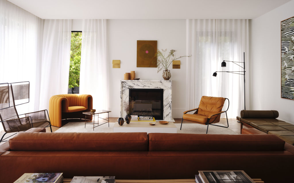 The living room revolves around the original fireplace. Photo: Dave Wheeler
